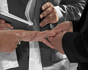Wedding photograph of ring exchange ceremony . 