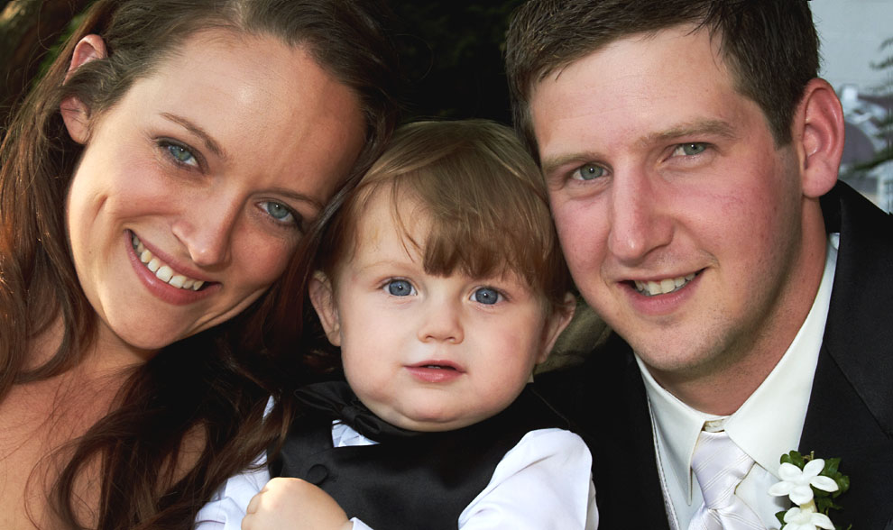 wedding photo of bride, groom and son