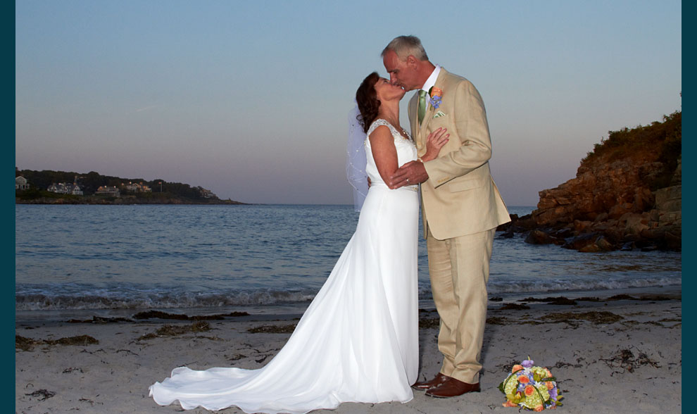 photo of newlywed couple on New Hampshire beach