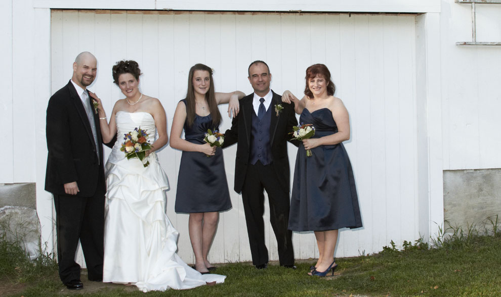 wedding party photograph by barn in New Hampshire