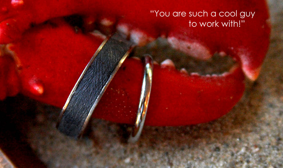 photo of wedding rings on a lobster claw